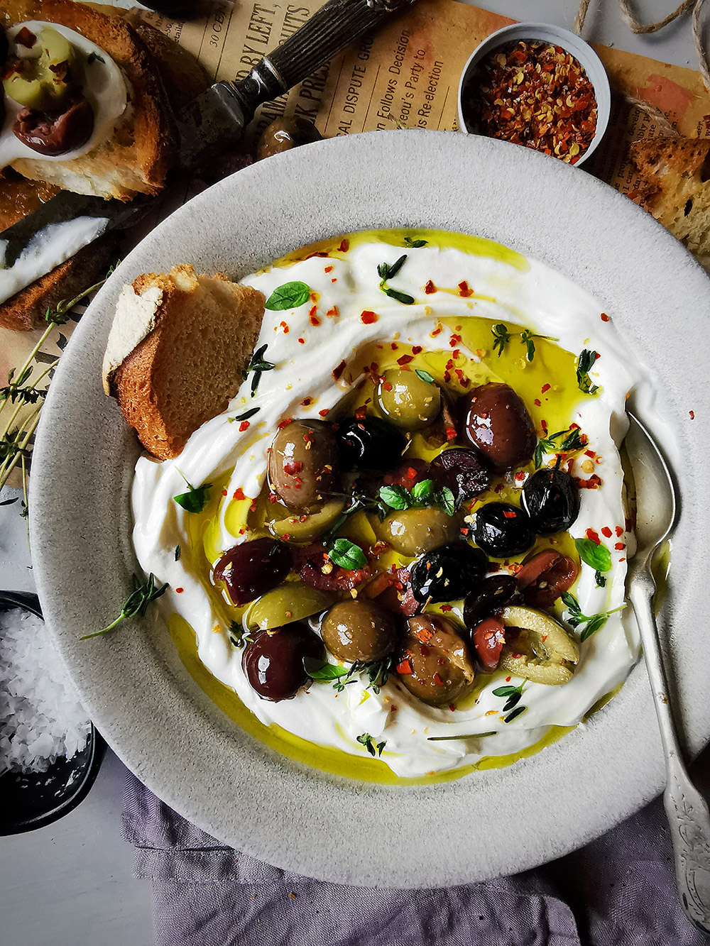 Creamy goat cheese labneh spread with olives