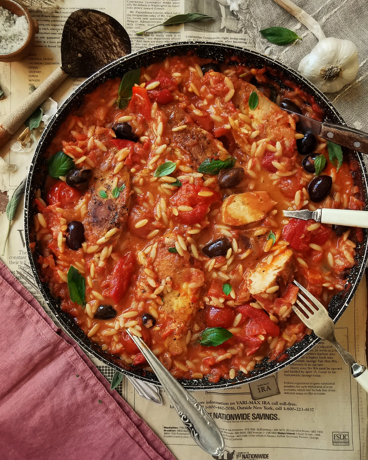 Delicious chicken with tomatoes, olives, orzo, red pepper, olives and basil